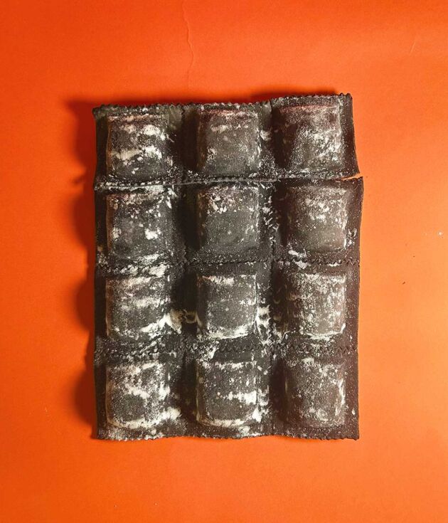 Raviolones de merluza y langositno